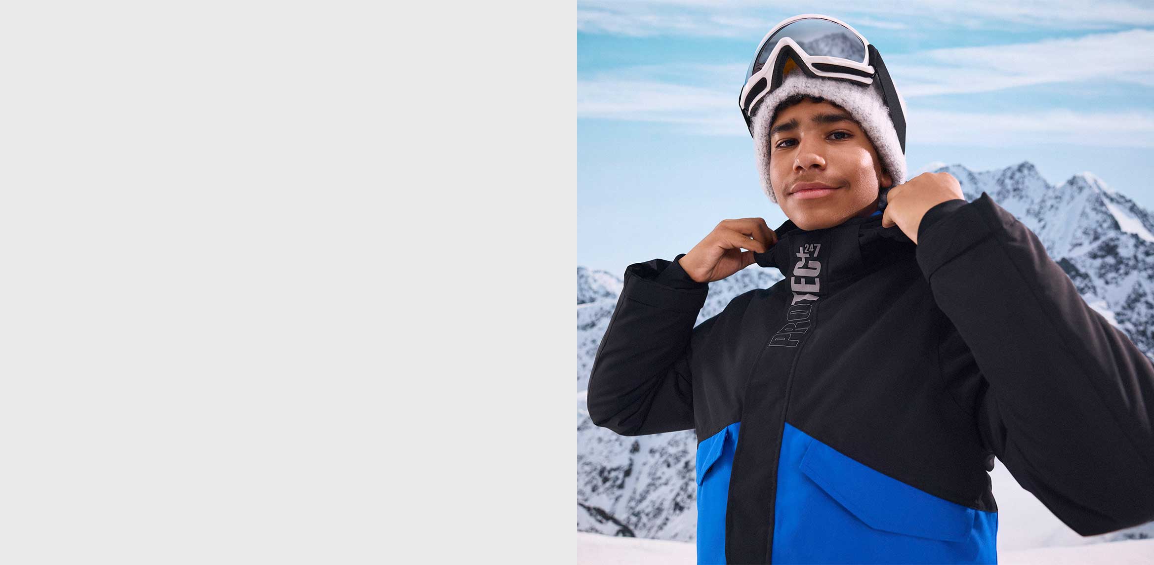 Junge in Winterjacke.