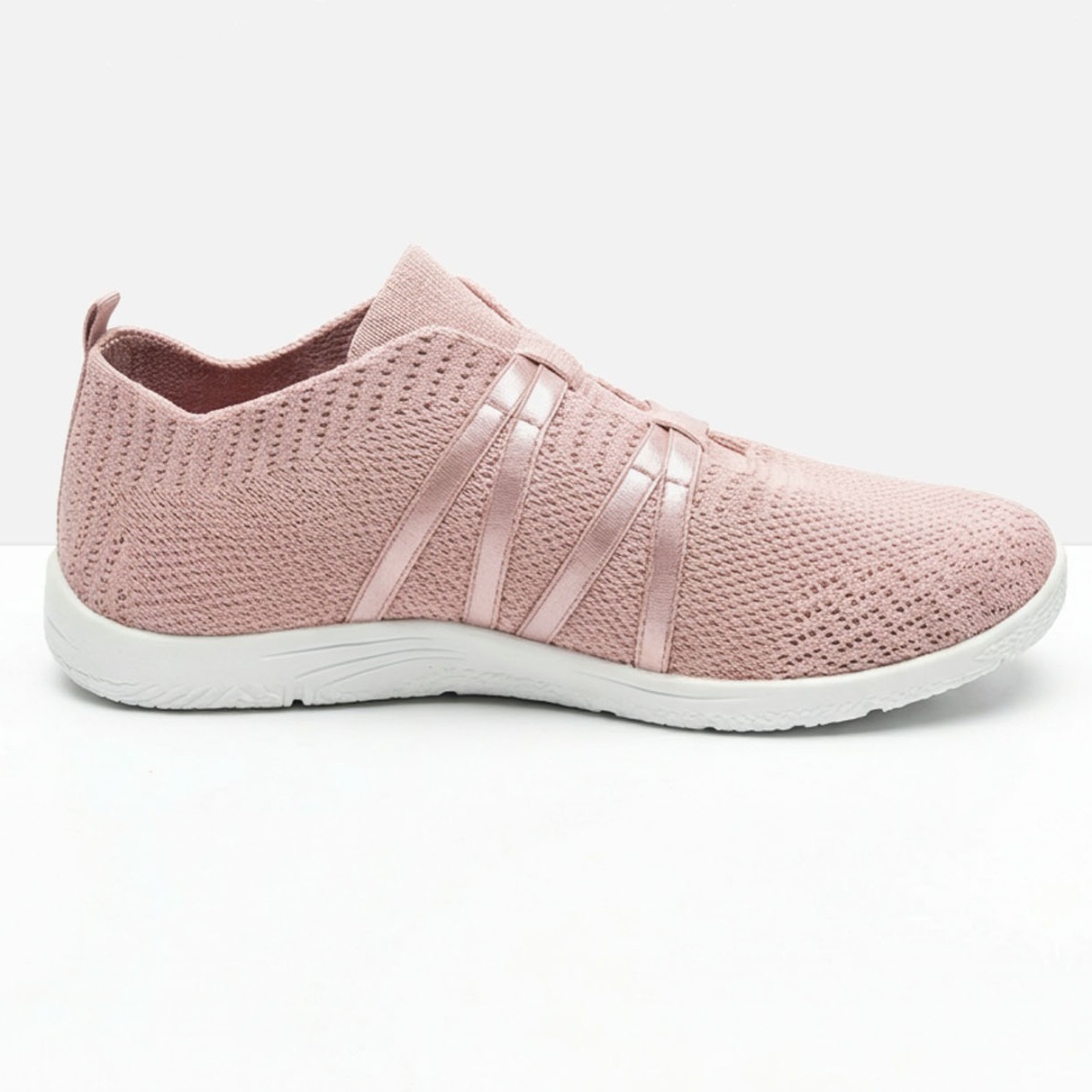 Rosa Sneaker mit Mesh-Material und weißer Sohle.