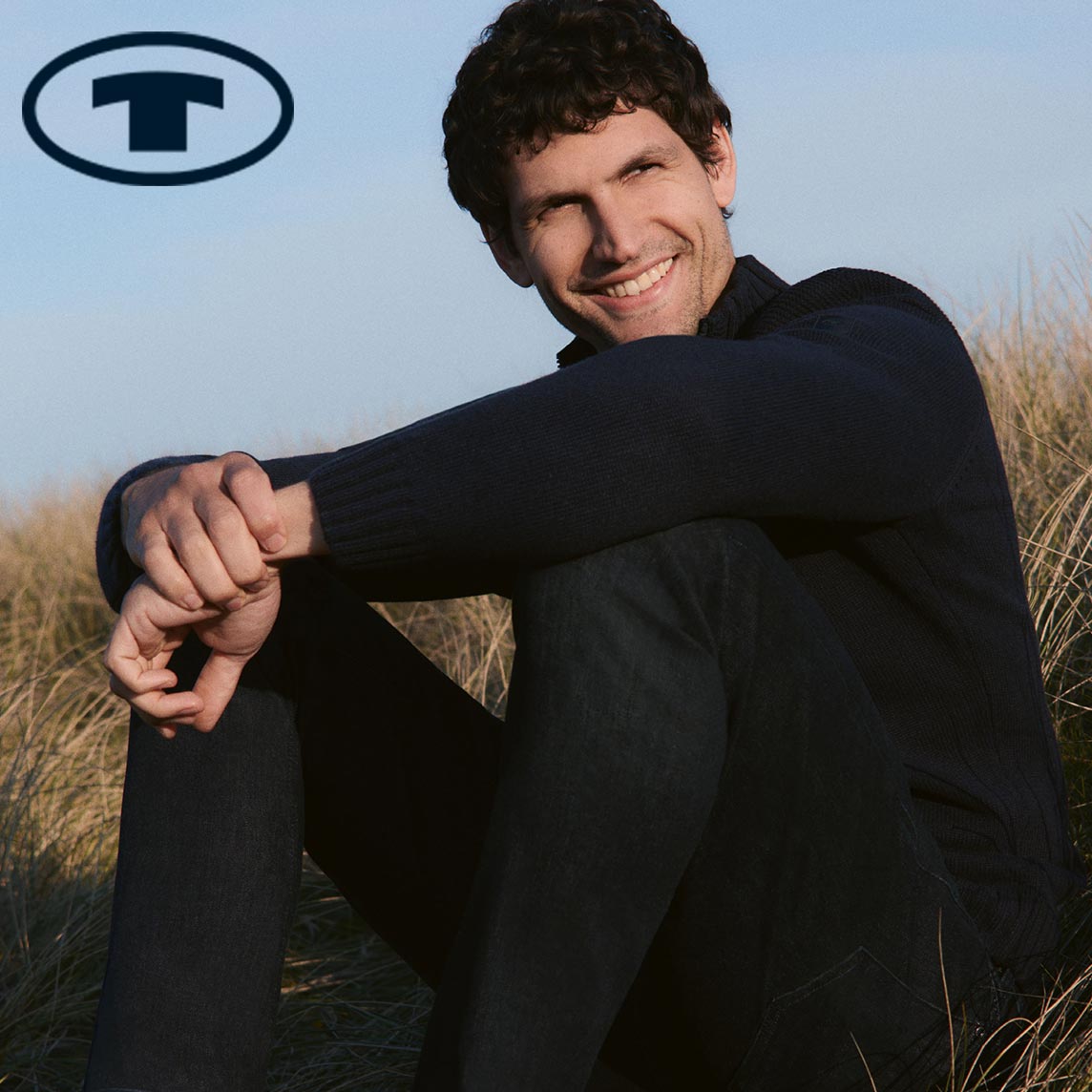 Dunkle, elegante Kleidung der Marke Tom Tailor.