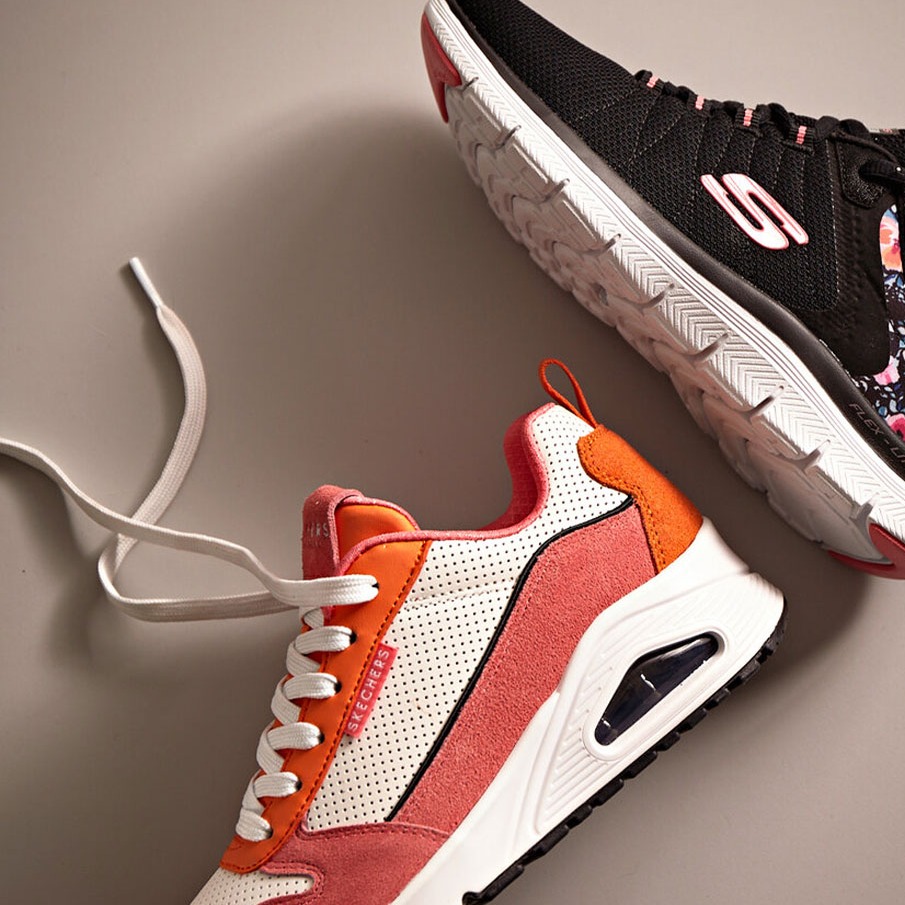Stylische Sneakers in Schwarz-Pink mit Blumen und frischem Weiß-Orange.