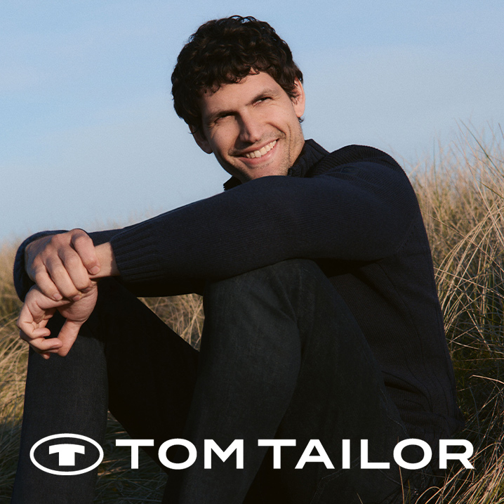 Dunkle, elegante Kleidung der Marke Tom Tailor.